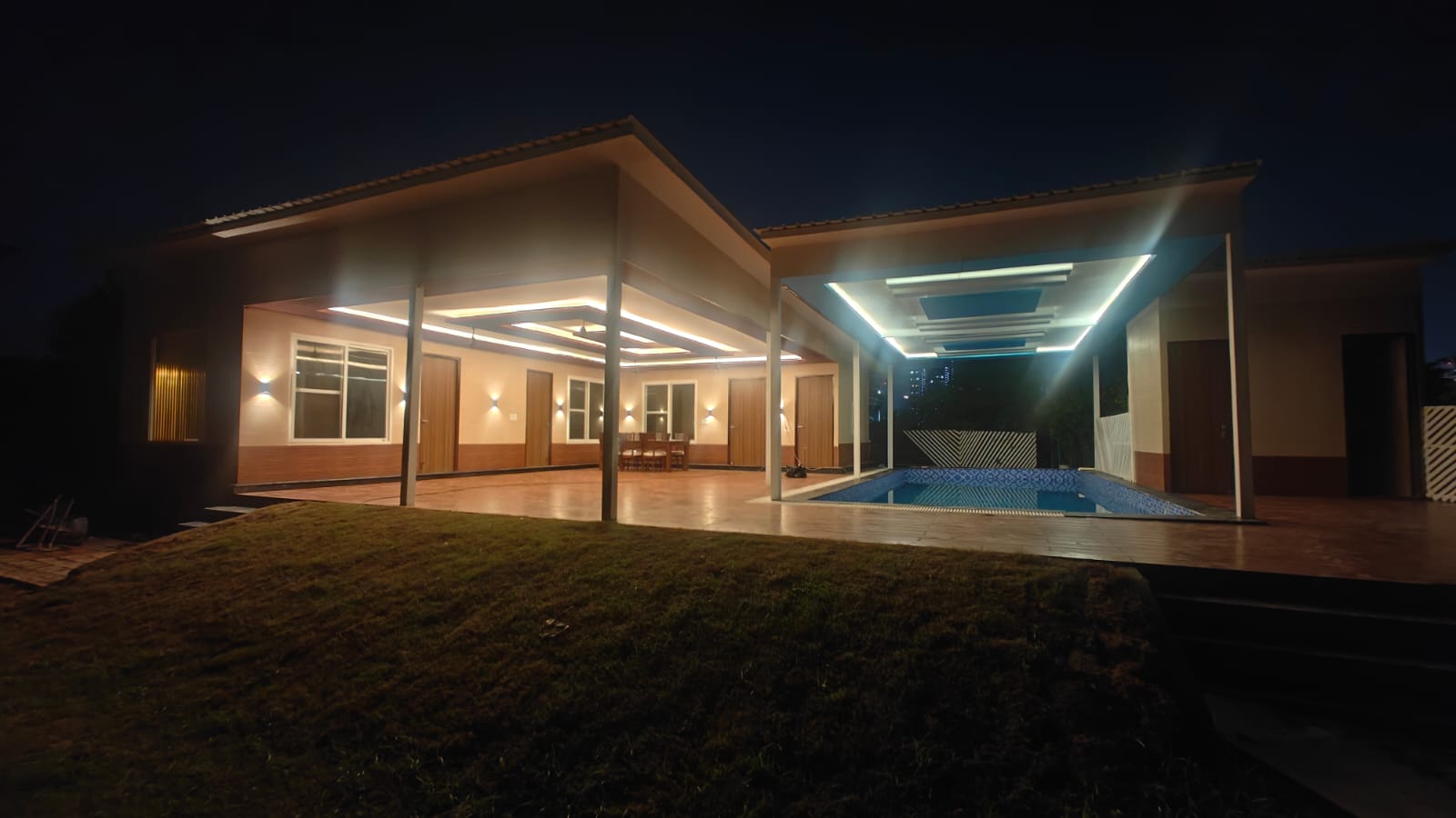 The farmhouse exterior at night